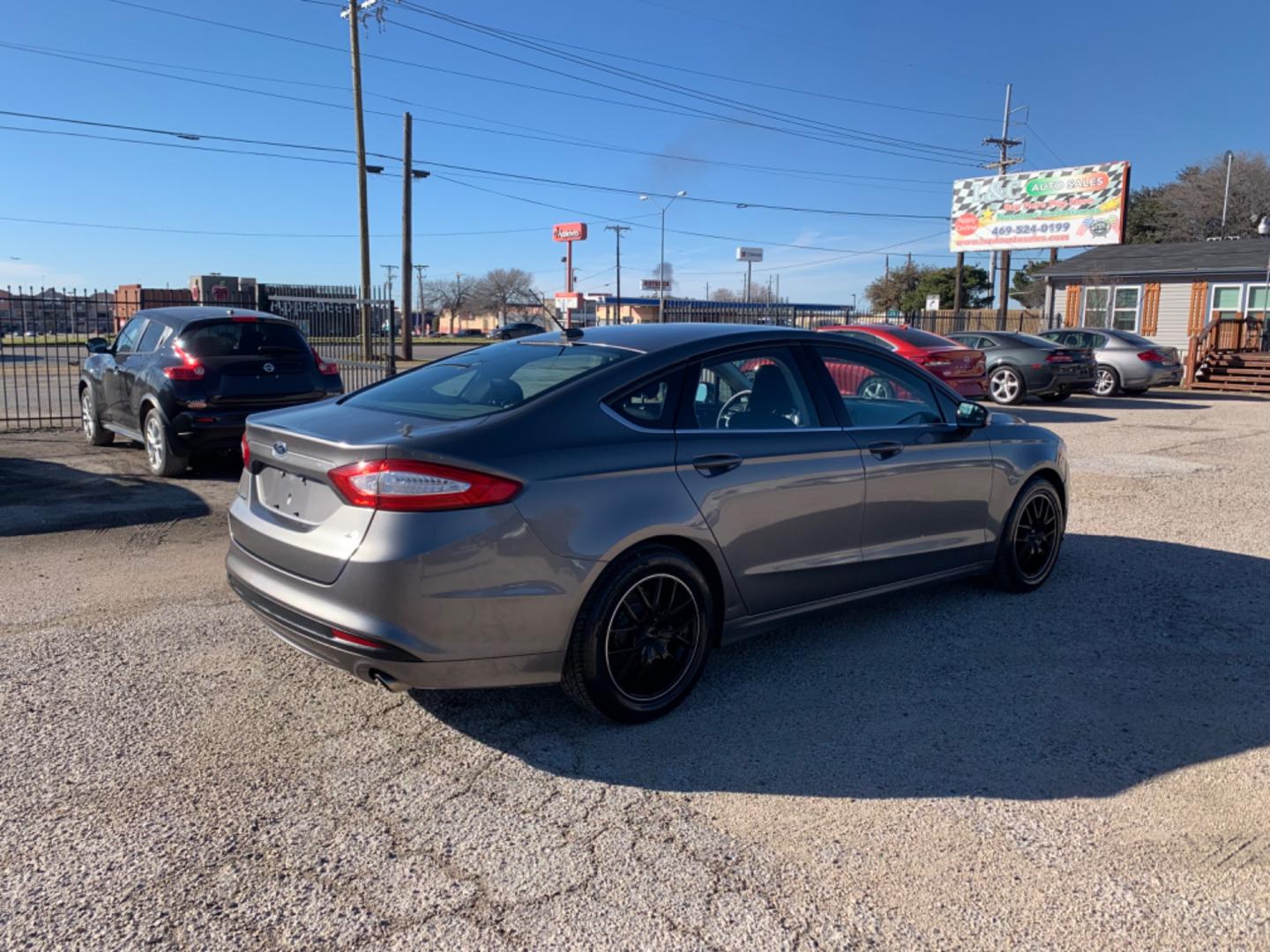 2013 Black /Black Ford Fusion (3FA6P0H79DR) with an 4 Cylinders D 1.5L DI Turbo DOHC 091 CID engine, AUTOMATIC transmission, located at 1830 North Belt Line Road, Irving, TX, 75061, (469) 524-0199, 32.834373, -96.993584 - Photo#5